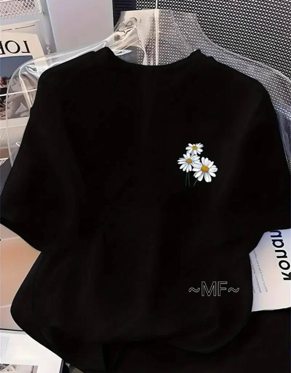 BLACK TEE WITH A FLORAL DESIGN