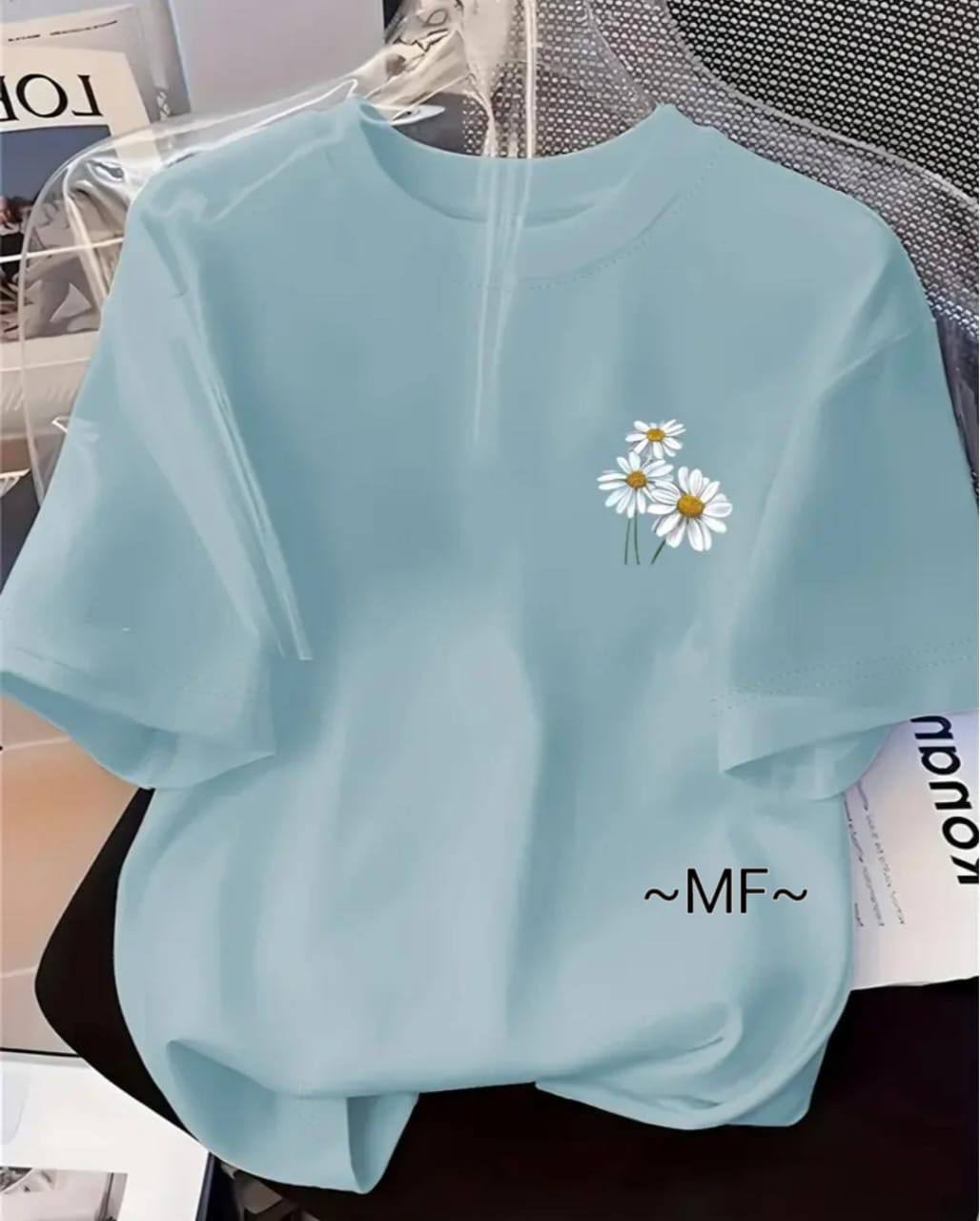LIGHT BLUE TEE WITH A FLORAL DESIGN