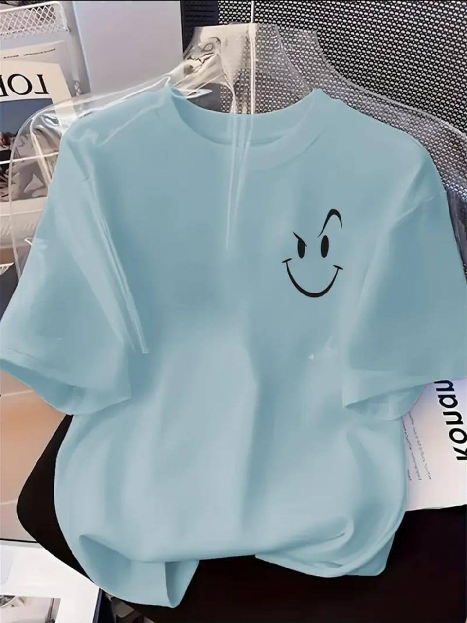 LIGHT BLUE TEE WITH AN ATTITUDED SMILEY FACE PRINT