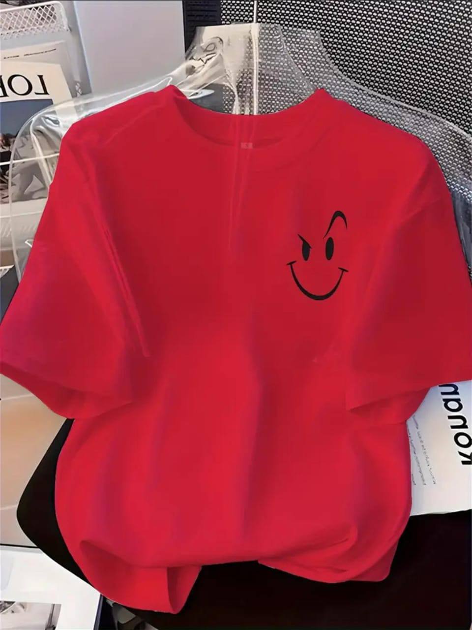 RED TEE WITH AN ATTITUDED SMILEY FACE PRINT